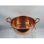 A Good Quality 19th Century Copper Jam Pan with Handles, together with an antique copper bed warmer.