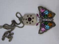 A Silver and Coloured CZ Brooch in the form of a Butterfly, together with a white metal stylized