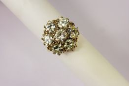 A Lady's 18 ct Yellow and White Gold Brilliant Cut Diamond Daisy Cluster Ring, the ring set with