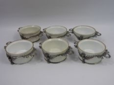 A Set of Six Stirling Silver Ramekin Holders, with companion porcelain ramekins (6)