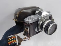 A Vintage 35 mm Nikkormat ft Camera, serial nr 3236725, with Nikkor-8 Auto 1:3.5 f = 2.8 cm lens and