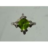 A Lady's Gems 18 ct Gold White Gold Peridot and Diamond Ring, peridot measures 1.88 ct dias 12.1mm