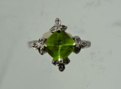 A Lady's Gems 18 ct Gold White Gold Peridot and Diamond Ring, peridot measures 1.88 ct dias 12.1mm