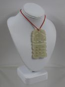 A Chinese White Jade Pendant.