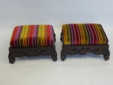 A Pair of 19th Century Hand Carved South Asian Footstools, having carved vine friezes on turned