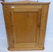 A Stripped Pine Corner Cabinet, having two scalloped shelves, approx 85 x 44 x 105 cms