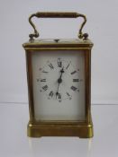 A French Brass Cased Mantel Clock, white enamel face with Roman dial, S & F Movement, approx 19 x