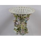 An Antique Coburg Dresden Table Centrepiece, raised on central scrolled column decorated with hand
