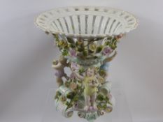 An Antique Coburg Dresden Table Centrepiece, raised on central scrolled column decorated with hand