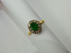 A Lady's 18 ct Yellow Gold Emerald and Diamond Ring, emerald 7 x 6 mm, approx 25 pts 8 ct dias, size
