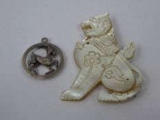 A Silver Zodiac Pendant, together with a mother of pearl brooch. (2)