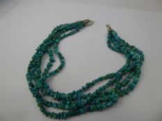 A Ethnic Style Six Strand Turquoise and Silver Necklace, approx 41 cms.