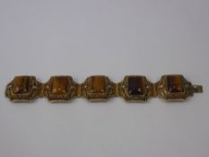 A Silver Gilt and Tigers Eye Bracelet, the bracelet having filigree mounts in the form of