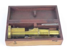 A Victorian Student's Brass Microscope, the microscope is fitted with original brass tweezers.