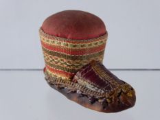 An Antique Pin Cushion, in the form of an Eskimo Snow Shoe.