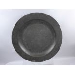 An English Pewter Plain Rim Charger, circa 1725, faint maker's touch marks and hallmarks to verso,