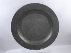 An English Pewter Plain Rim Charger, circa 1725, faint maker's touch marks and hallmarks to verso,