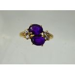 A Lady's Antique 9 ct Gold Amethyst and Diamond Ring, 2 x amethyst 7.5mm, 4 x 3.5 pts dias, size