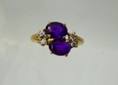 A Lady's Antique 9 ct Gold Amethyst and Diamond Ring, 2 x amethyst 7.5mm, 4 x 3.5 pts dias, size