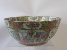 A Large 19th Century Cantonese Famille Rose Punch Bowl, decorated with shaped panels enclosing