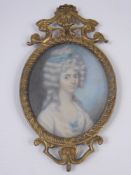 An 18th Century Portrait Miniature on Ivory, depicting a young woman, approx 8 x 6 cms