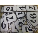 A Box of Enamel Number Tiles.