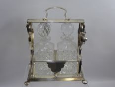 A Silver Plated Cut Glass Twin Decanter Tantalus.