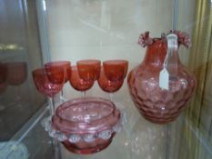 A Quantity of Late Victorian 'Cranberry' Glass, including pitcher, six sherry glasses, bon bon