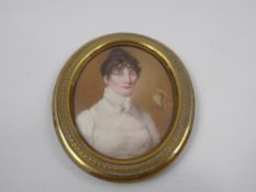 A 18th Century Portrait Miniature, depicting a young woman, approx 6 x 8 cms (af)