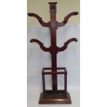 A Victorian Mahogany Coat and Umbrella Stand, the stand having four arms with peg hangers and rose