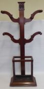 A Victorian Mahogany Coat and Umbrella Stand, the stand having four arms with peg hangers and rose