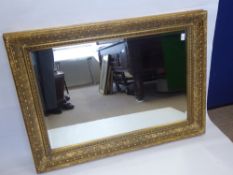 An Ornate Gilt Frame Effect Hall Mirror, with bevelled glass, approx 80 x 112 cms