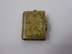 An Antique 12 ct Gold Double Locket Pendant, the pendant in the form of a book and clasp engraved