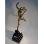 GOLD PAINTED FIGURE ON A STONE BASE