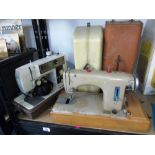 2 CASED SEWING MACHINES