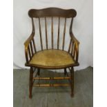 An early 20th century oak occasional chair with leather seat A/F