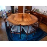 A 1970s Dyrlund of Denmark Rosewood circular dining table and eight matching spindle back chairs (