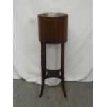 Edwardian mahogany plant stand with detachable metal liner on four splay legs