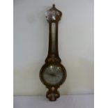 An Edwardian rosewood mercurry barometer cum thermometer inlaid with mother of pearl birds,