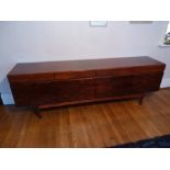 A 1970s Danish Rosewood sideboard, rectangular on four tapering cylindrical legs