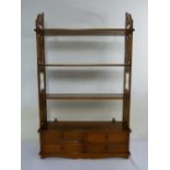 Mahogany wall shelf with four drawers and scroll pierced sides