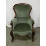 Victorian upholstered mahogany armchair with cabriole legs