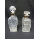 Two cut glass decanters with drop stoppers and silver collars - A/F