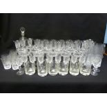 A quantity of early 20th century drinking glasses to include wine and champagne glasses and a