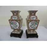 Pair of Oriental enamel vases decorated with birds, flowers and leaves on carved and pierced