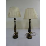 A pair of lacquered table candlesticks in Oriental style to include shades