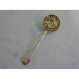Russian silver sifter spoon with pierced gilt bowl