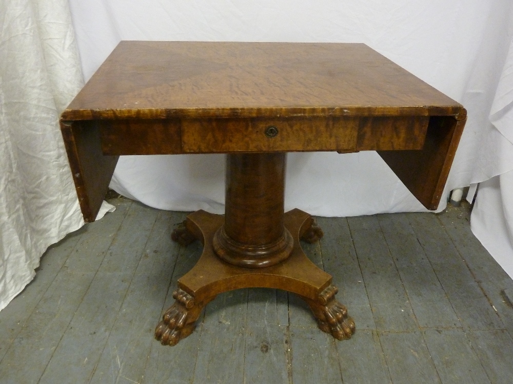 Drop flap library table on pedestal base with four carved claw feet