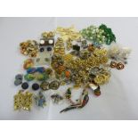A quantity of costume jewellery to include brooches, earrings, necklaces and rings