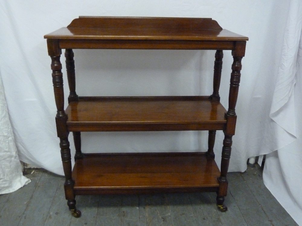 Victorian mahogany three tier buffet on original castors